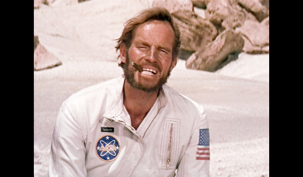 Surviving Captain Taylor (Charlton Heston) enjoys a cigar and good laugh at the fate of his expedition to THE PLANET OF THE APES.