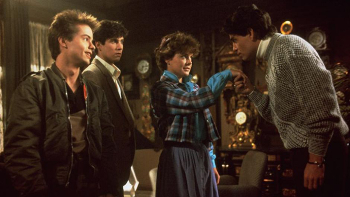 FRIGHT NIGHT (L to R) Stephen Geoffreys, William Ragsdale, Amanda Bearse and Chris Sarandon prepare for a vampire test.