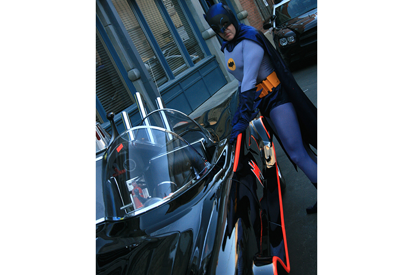 Tom Woodruff Jr.'s alter ego Batman poses with his authentic Batmobile replica car