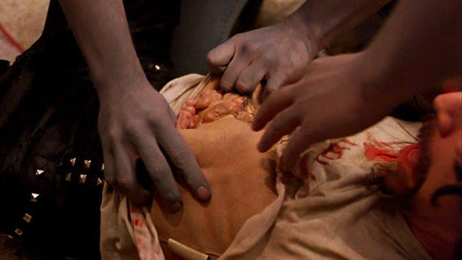 Closer angle showing the edges of Taso Stavrakis' torso gore appliance visible in the final film, a performance accident only noticed upon multiple viewings of DAWN OF THE DEAD, as referenced by Greg Nicotero in Part 2 of our podcast.