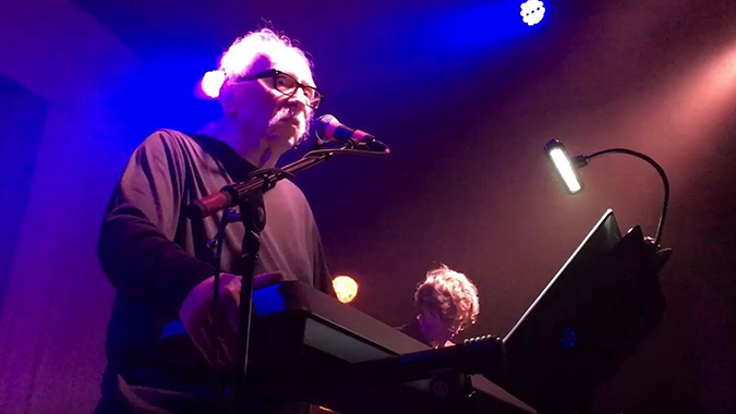 John Carpenter seen live in concert, recently performing his many themes and score cues from his films as compiled in his two albums LOST THEMES and LOST THEMES II.
