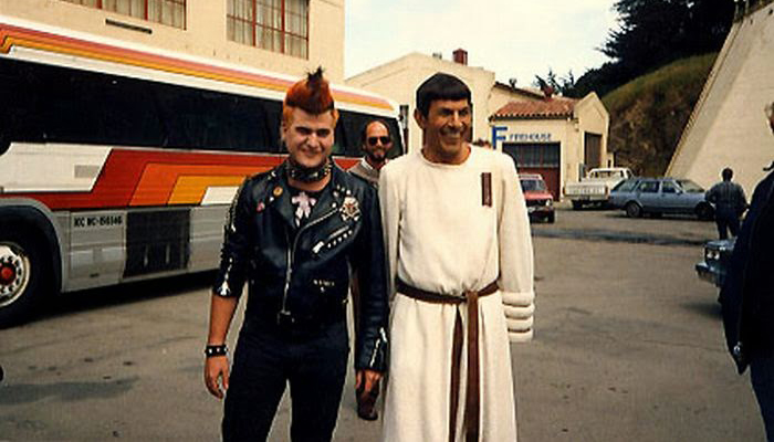 Candid behind the scenes photo of Kirk Thatcher in his punk costume and Leonard Nimoy as Spock during production of STAR TREK IV: THE VOYAGE HOME.