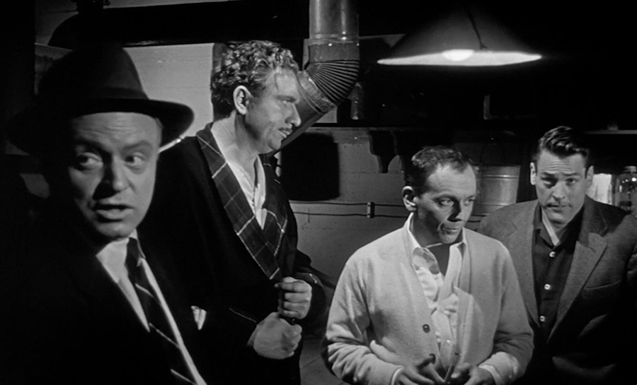 A tense scene intensifying the paranoia from INVASION OF THE BODY SNATCHERS featuring (L to R): Larry Gates, Kenneth Patterson, King Donovan and Kevin McCarthy.